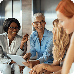 Four women having a meeting