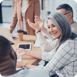 Woman smiles at a colleague during a meeting