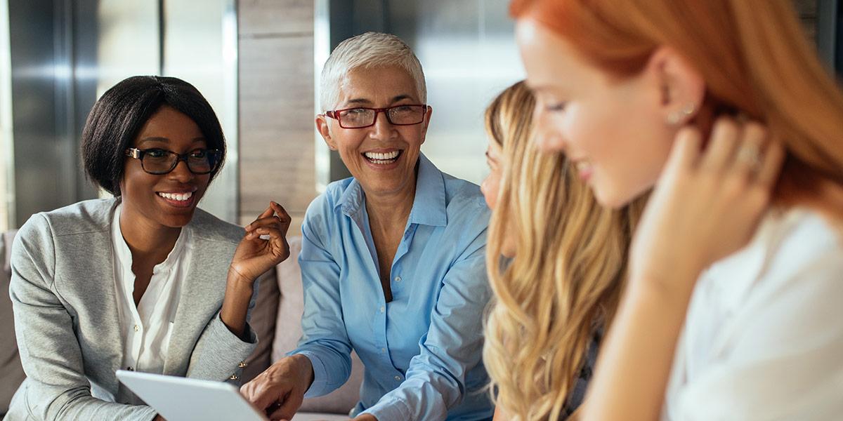 Four women having a meeting